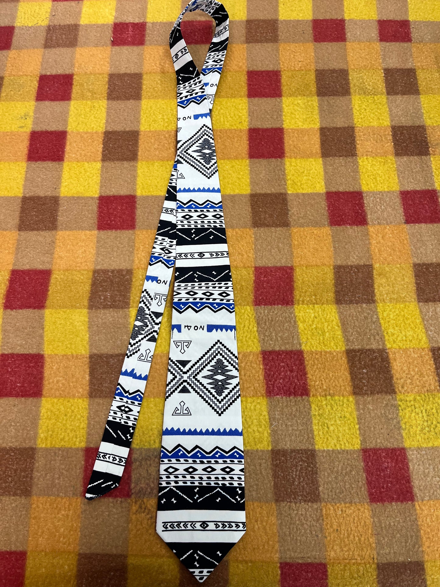 60” Necktie, 12x12” pocket square. White/balck/blue tribal