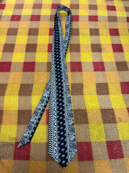 60” Necktie, 12x12” pocket square.  Black/white stripe paisley