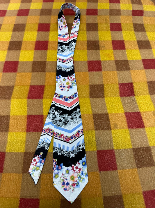 60” Necktie, 12x12” pocket square. Black/blue/pink floral