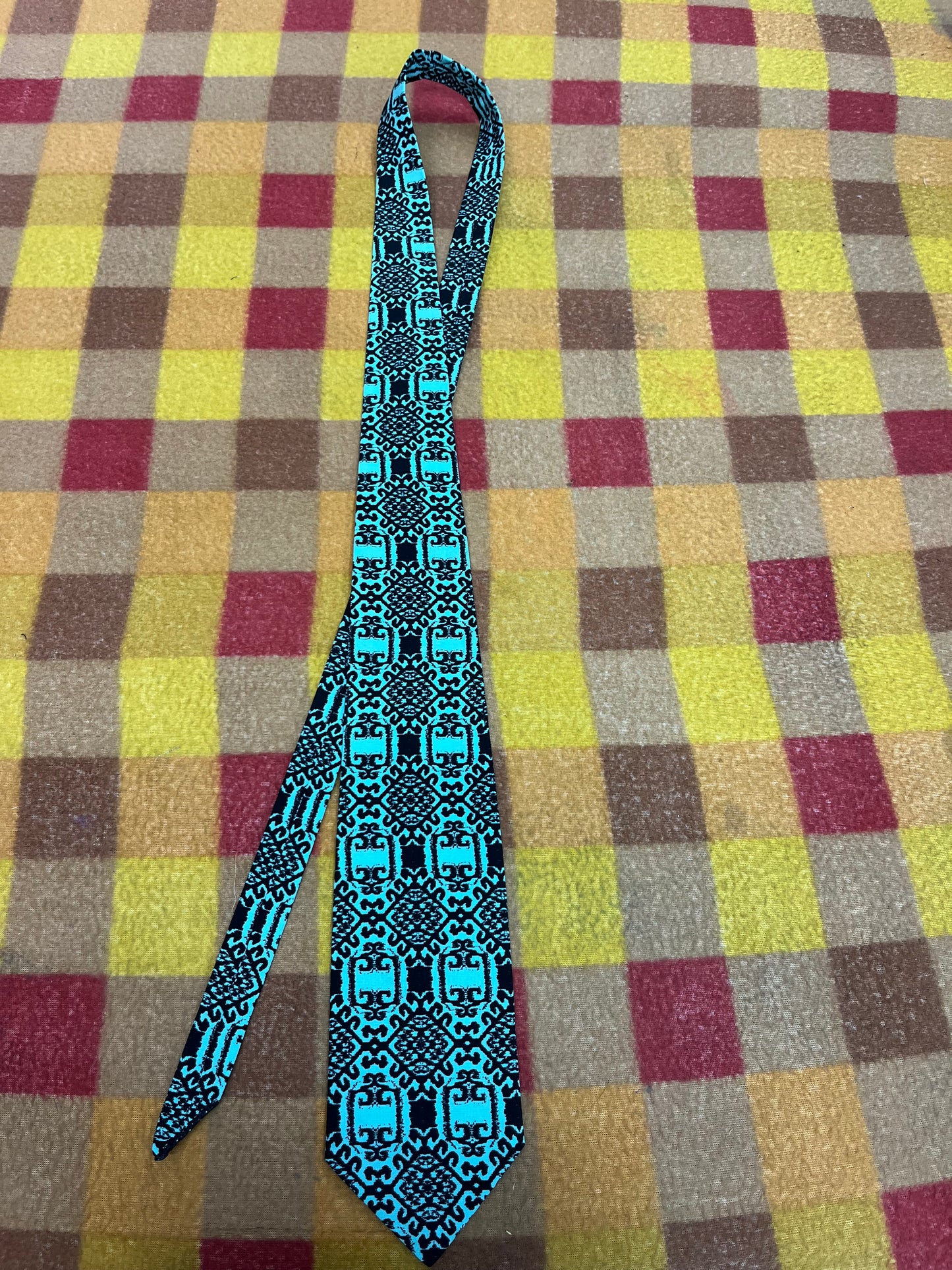 60” Necktie, 12x12” pocket square. Turquoise/ black diamond