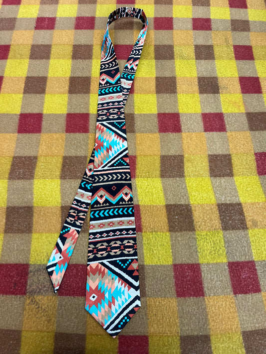 60” Necktie, 12x12” pocket square. Black/ burnt orange / teal tribal