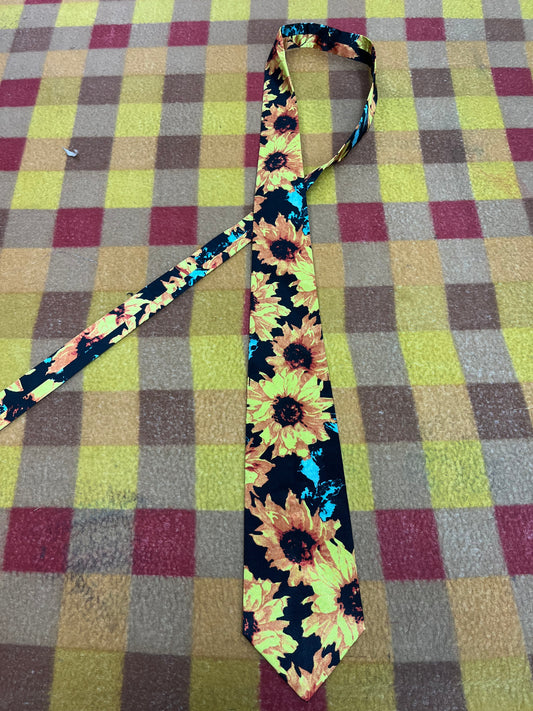 60” Necktie with matching 12”x12” pocket square. Sunflowers/ black
